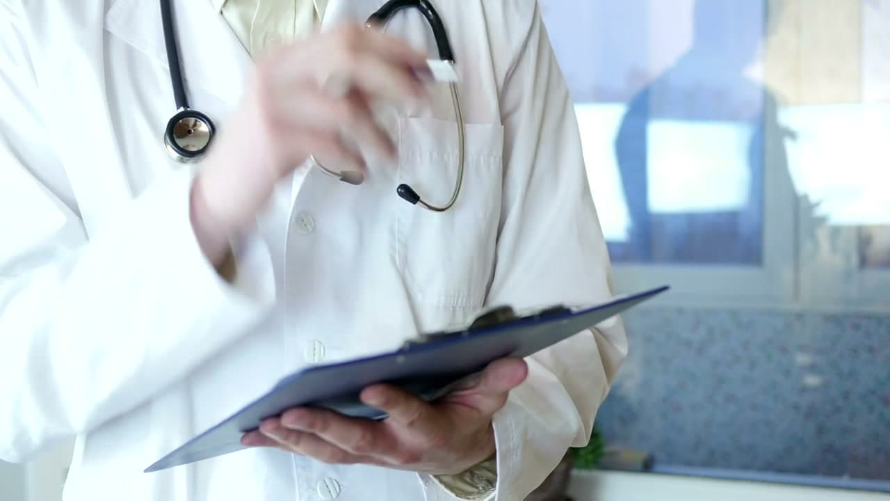 Clinical coordinator conducting specialized health assessment